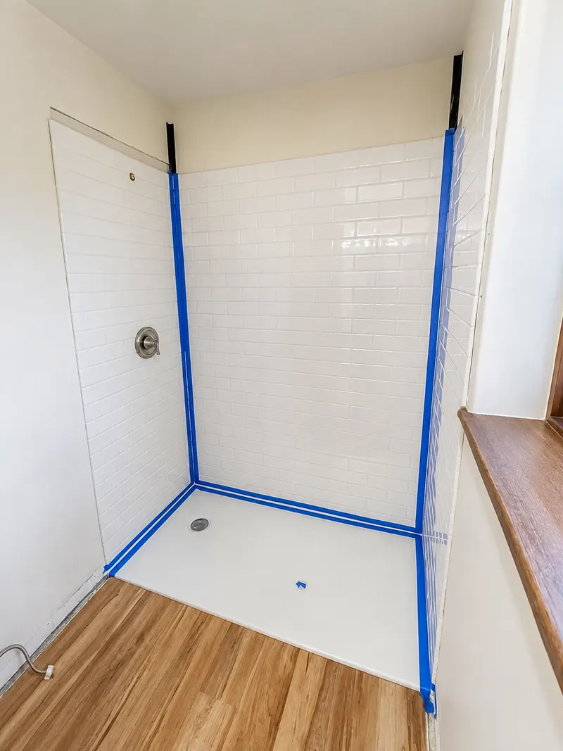 Shower base and tile in, edges taped, Bathroom Renovation 7 by Altitude Renovation
